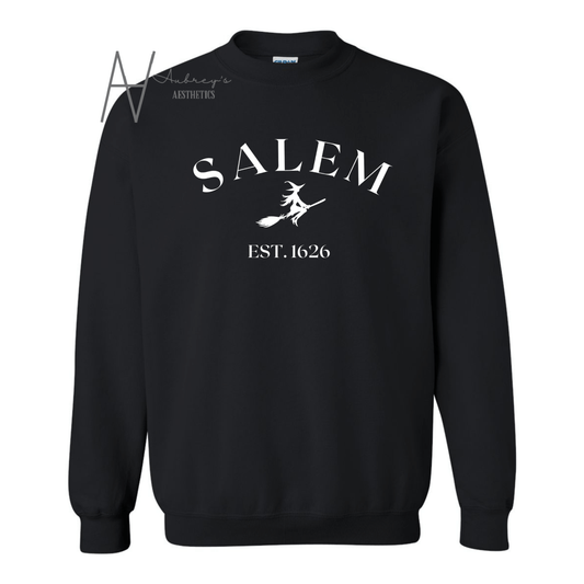 black crewneck with Salem and witch design on front